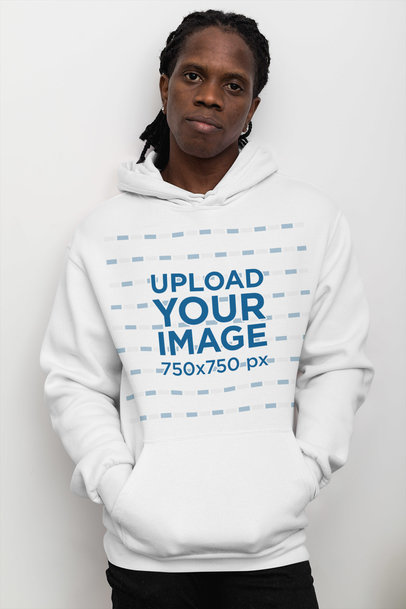 Pullover Hoodie Mockup Featuring a Serious-Looking Man by a Clear Wall