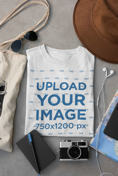 Mockup of a Folded T-Shirt Placed Between Some Accessories 