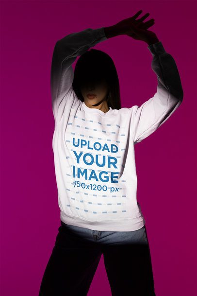 Gildan Crewneck Sweatshirt Mockup of a Woman With a Serious Look Standing Under a Spotlight m50006