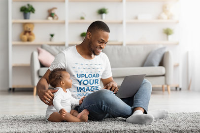 Father's Day-Themed T-Shirt Mockup Dad Working While Taking Care of His Baby