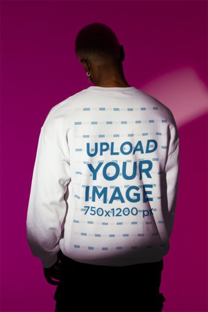 Back-View Gildan Sweatshirt Mockup of a Man Standing Under a Spotlight m50013