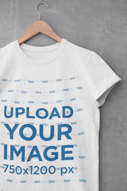 Mockup of a Crewneck T-Shirt Hanging by a Cement Wall 